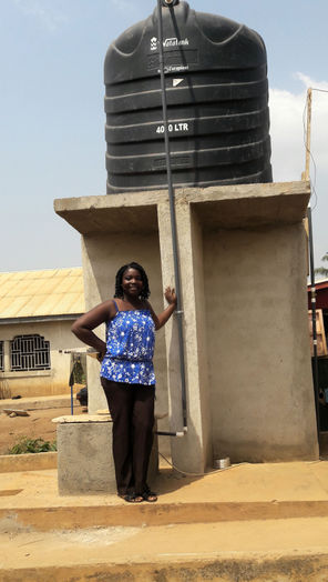 , Janet constructed four public water stands and employs local women to run them. 